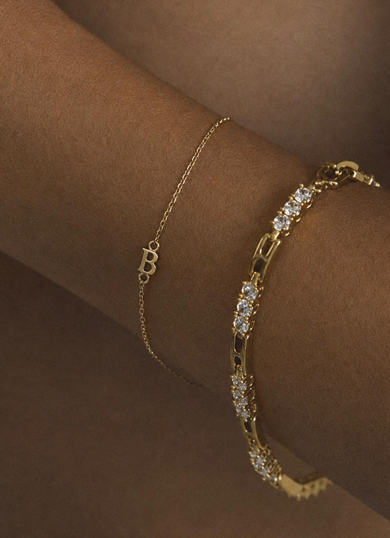 Lumière Tennis Bracelet — lifestyle shot worn on the wrist, solid 14k gold with round brilliant lab-grown diamonds