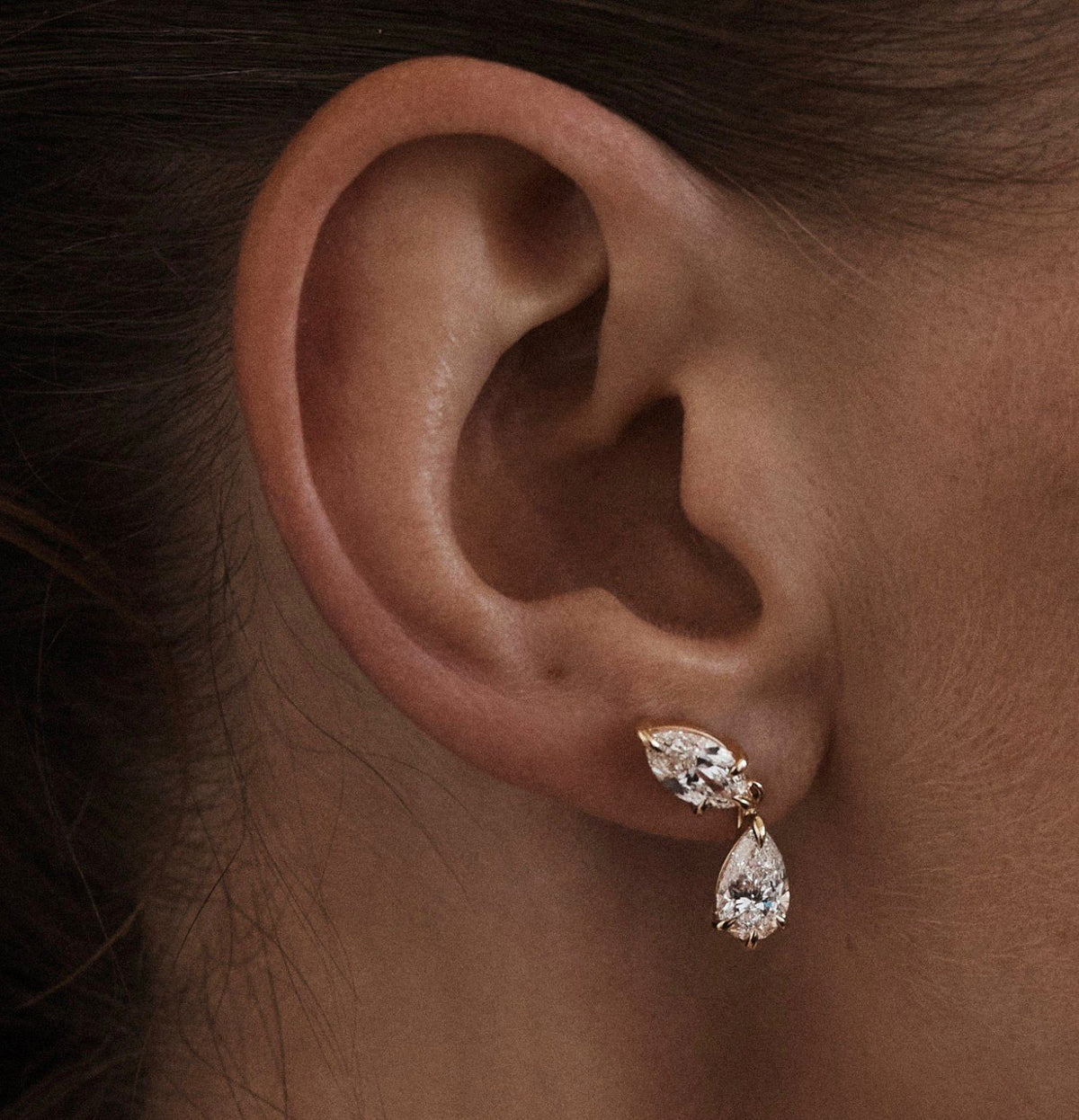 Poire Drop — on-model shot falling from the lobe, solid 14k gold with marquise and pear lab-grown diamonds
